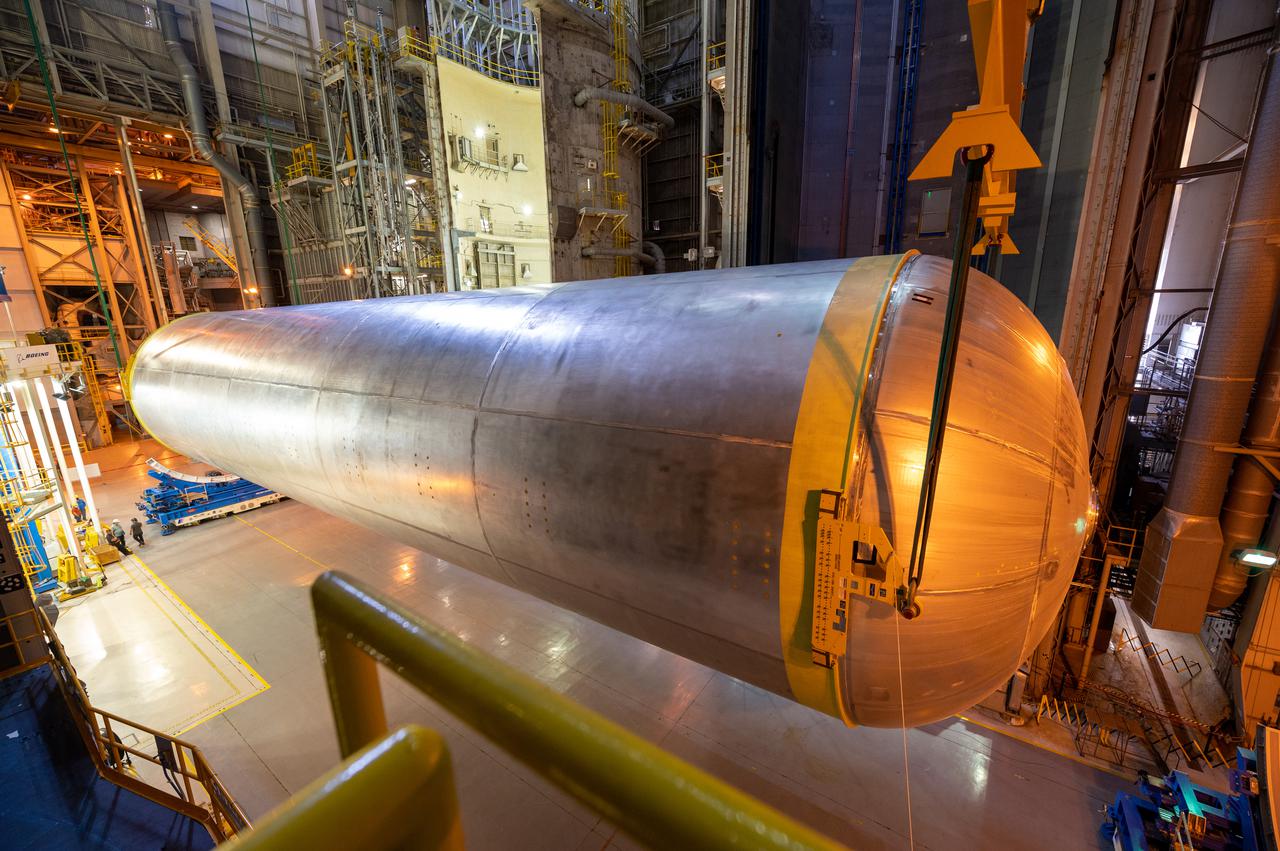 This image highlights the liquid hydrogen tank that will be used on the core stage of NASA’s Space Launch System rocket for Artemis II, the first crewed mission of NASA’s Artemis program. The tank is being built at NASA’s Michoud Assembly Facility in New Orleans. The SLS core stage is made up of five unique elements: the forward skirt, liquid oxygen tank, intertank, liquid hydrogen tank, and the engine section. The liquid hydrogen tank holds 537,000 gallons of liquid hydrogen cooled to minus 423 degrees Fahrenheit and sits between the core stage’s intertank and engine section. The liquid hydrogen hardware, along with the liquid oxygen tank, will provide propellant to the four RS-25 engines at the bottom of the cores stage to produce more than two million pounds of thrust to launch NASA’s Artemis missions to the Moon. Together with its four RS-25 engines, the rocket’s massive 212-foot-tall core stage — the largest stage NASA has ever built — and its twin solid rocket boosters will produce 8.8 million pounds of thrust to send NASA’s Orion spacecraft, astronauts and supplies beyond Earth’s orbit to the Moon and, ultimately, Mars. Offering more payload mass, volume capability and energy to speed missions through space, the SLS rocket, along with NASA’s Gateway in lunar orbit, the human landing system, and Orion spacecraft, is part of NASA’s backbone for deep space exploration and the Artemis lunar program. No other rocket can send astronauts in Orion around the Moon in a single mission.